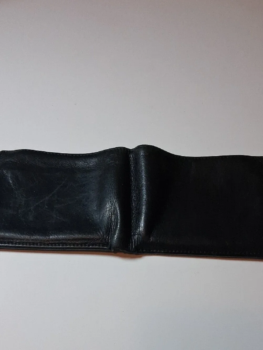 Tumi Black Leather Money Clip Wallet with Subtle Red Logo